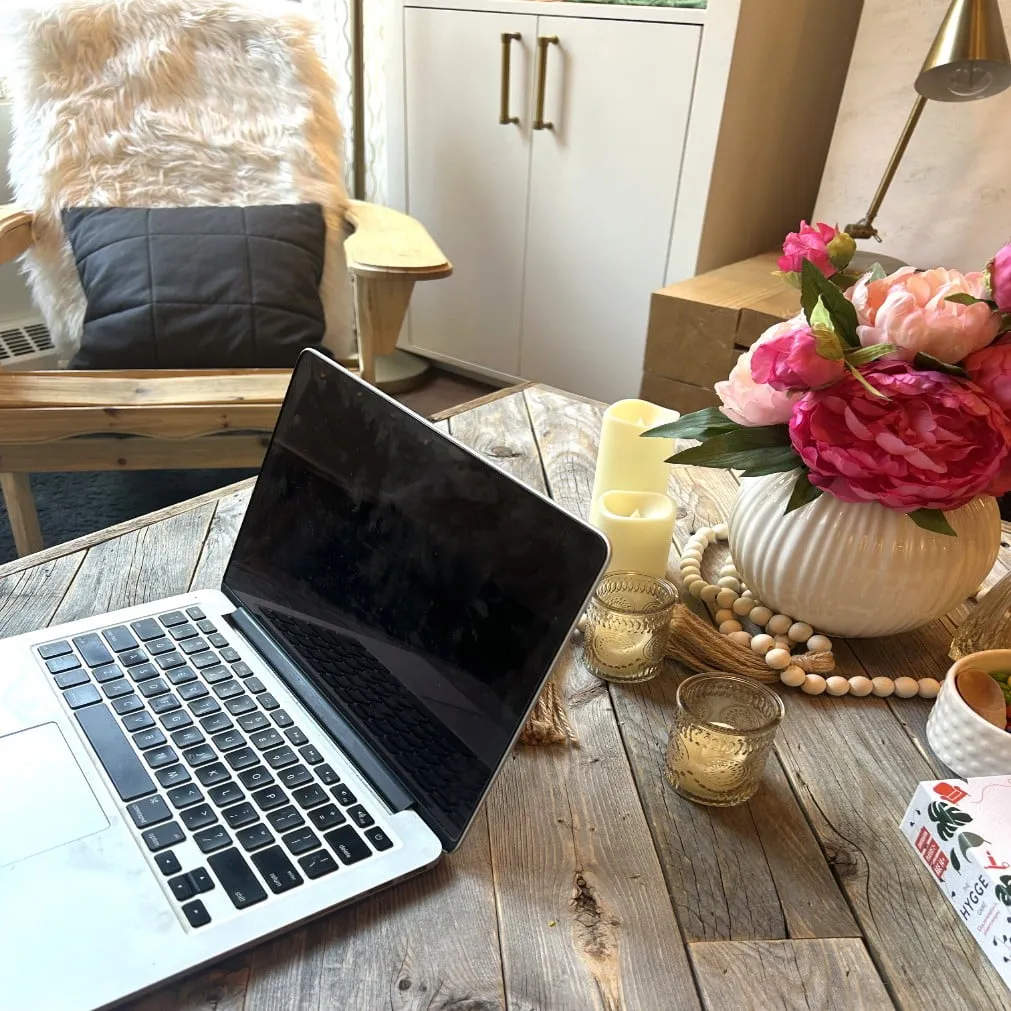 Suzy Rounce sitting working on her laptop