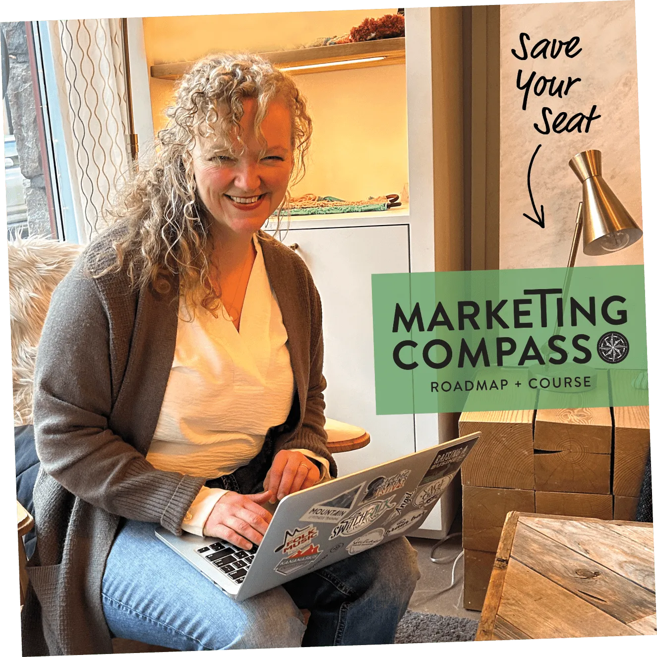 Suzy Rounce sitting working on her laptop